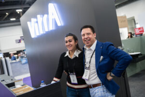 Exhibitors smiling at their booth at KBIS 2023