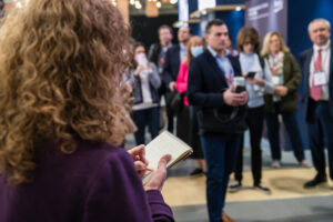 Attendee taking notes from the talk in KBIS 2023