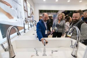 Exhibitors showing attendees kitchen products at KBIS 2023