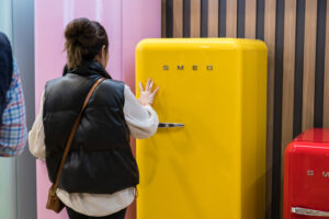 Attendee exploring Smeg products face-to-face at KBIS.