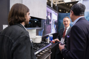 Exhibitor showcasing the brand's products to the attendees. at KBIS23