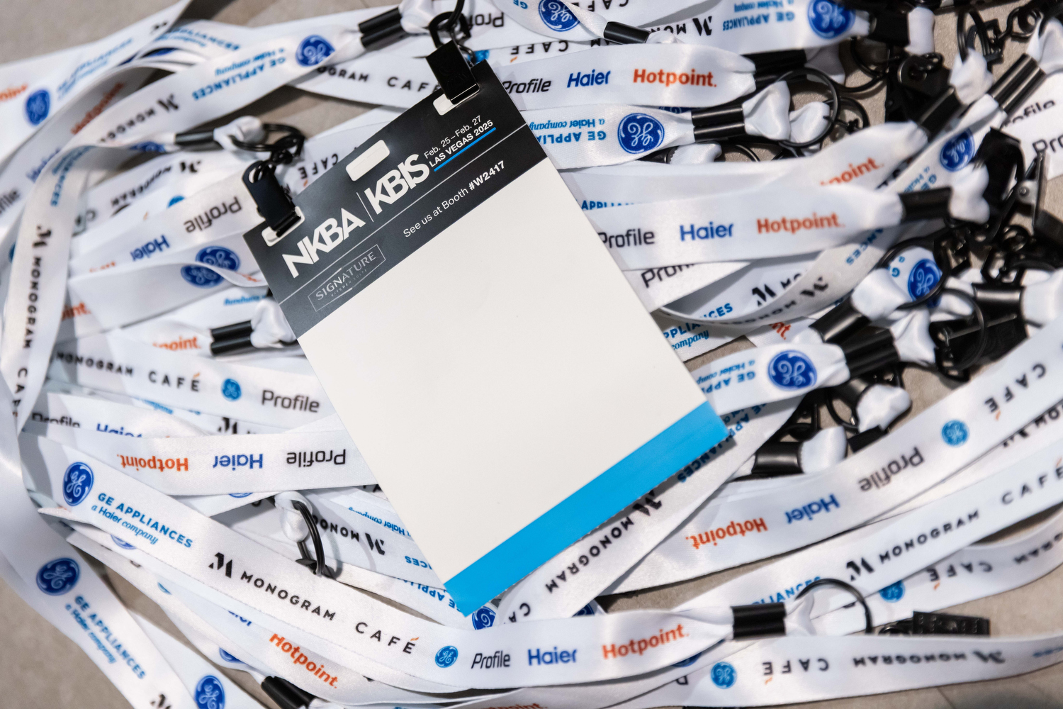 Designers discuss products at a beautiful booth in Discovery District at KBIS