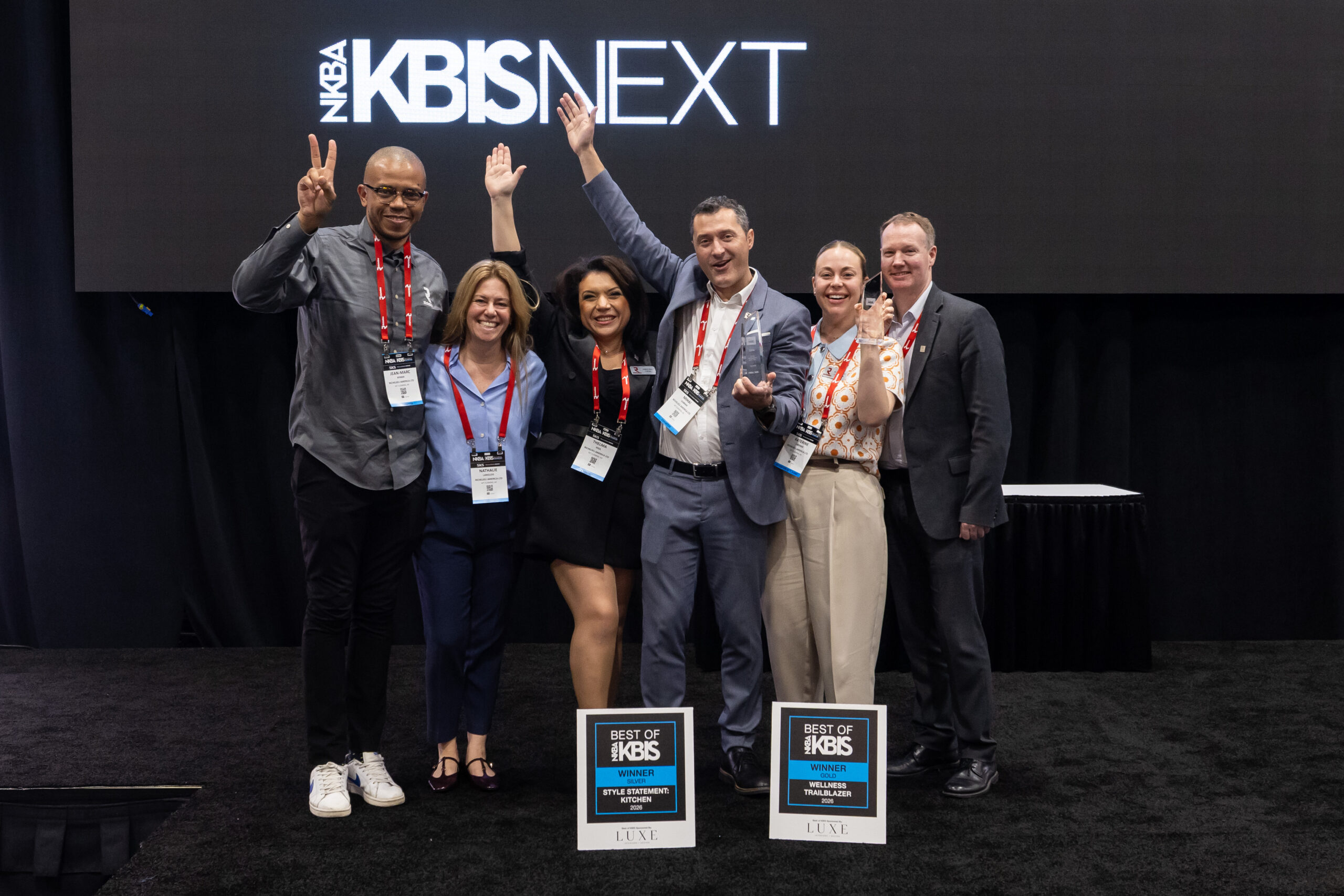 Three women assess and discuss materials for their next design at KBIS 2024