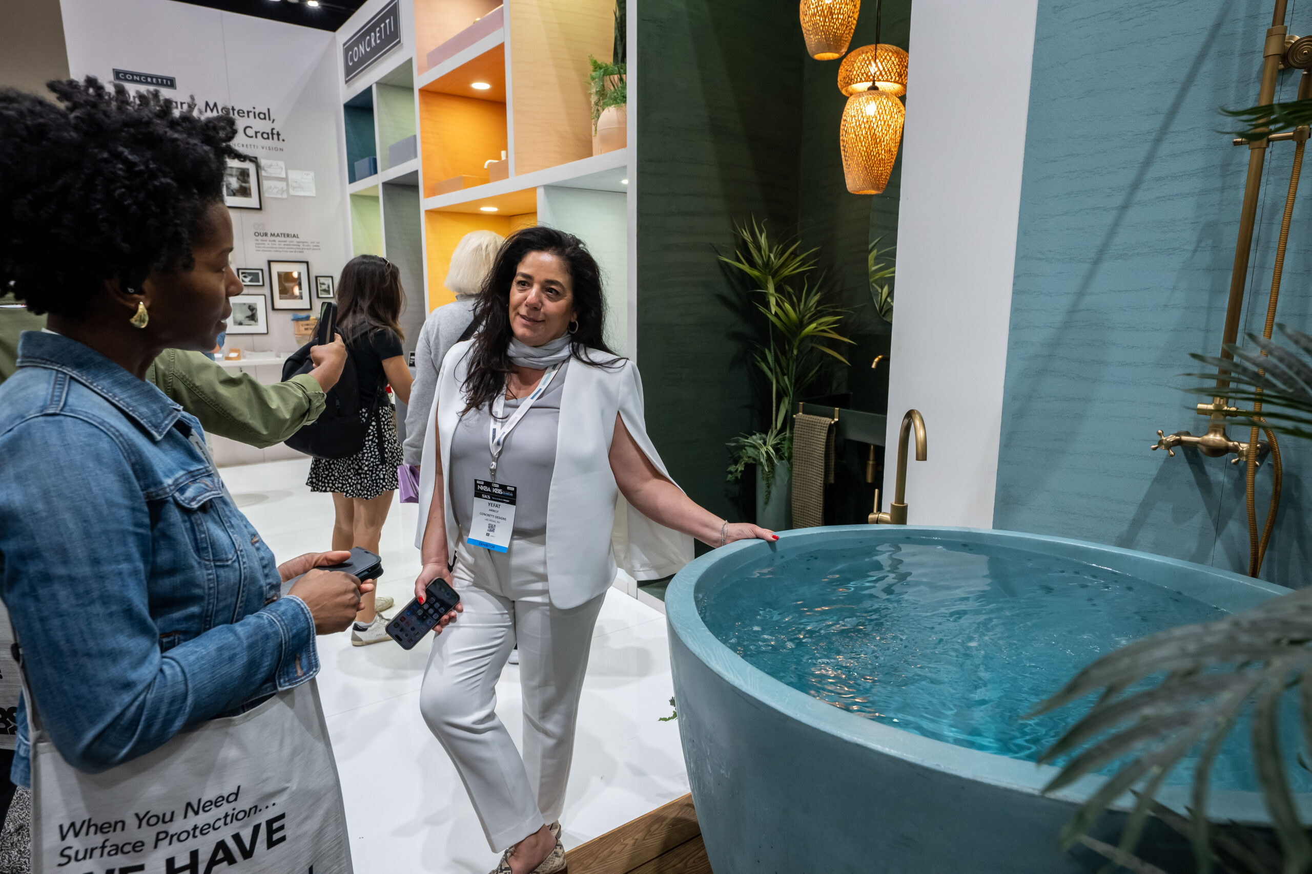 Attendees admire the Smeg x Dolce and Gabana Collaboration mini fridge at KBIS 2024